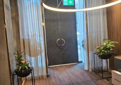 Bespoke wave voile curtains at a Michelin star restaurant, enhancing the modern and elegant interior with tailored soft furnishings.