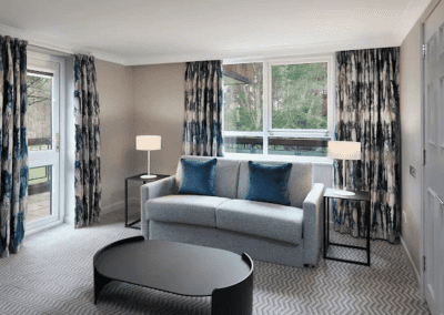 Hotel interior featuring contract hotel furniture and bespoke headboards to create an inviting and relaxed guest experience.