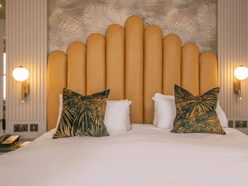 Bedroom interiors for a Victorian, seaside hotel featuring bespoke statement headboards, bedroom furniture and soft furnishings to complement the hotel’s aesthetic.