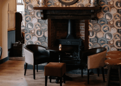 Interior of a country-style pub featuring contract furniture and soft furnishings, blending heritage charm with contemporary comfort.