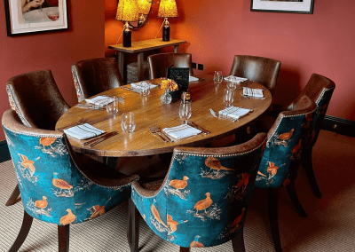 Interior of Ye Horns Inn, a grade II listed Inn featuring bespoke pub furniture including dining chairs, bar stools, and tables to enhance the heritage charm of the Inn.