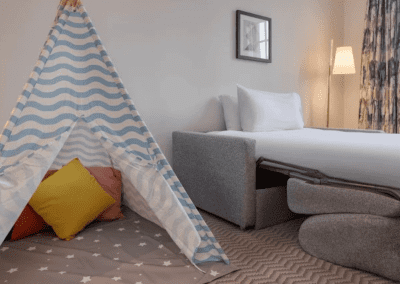 Hotel interior featuring contract hotel furniture and bespoke headboards to create an inviting and relaxed guest experience.