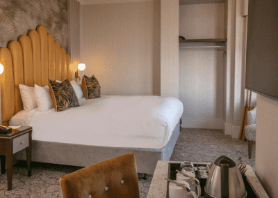 Bedroom interiors for a Victorian, seaside hotel featuring bespoke statement headboards, bedroom furniture and soft furnishings to complement the hotel’s aesthetic.