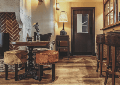 Interior of Ye Horns Inn, a grade II listed Inn featuring bespoke pub furniture including dining chairs, bar stools, and tables to enhance the heritage charm of the Inn.