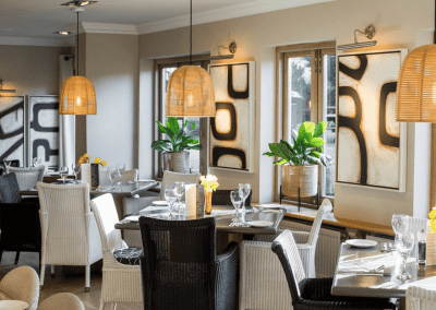 A stylish country pub interior for The Orange Tree Solihull, featuring bespoke dining chairs, tub chairs, and fixed seating made by Jameson Seating.