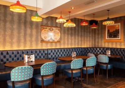 Bespoke pub furniture featuring bold fabrics, vibrant colours, and custom fixed seating by Jameson Seating
