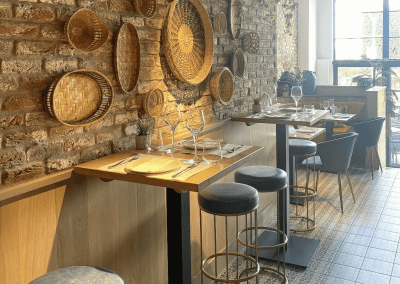 Bespoke bar and restaurant furniture for Botana Jersey, including dining chairs, bar stools and tables, featuring stylish Mediterranean-inspired design.