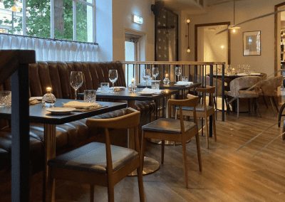 Bespoke eyelet screen curtains for Ganymede Belgravia, creating a stylish and private restaurant space.