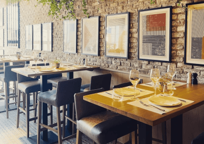 Bespoke bar and restaurant furniture including dining chairs, bar stools and tables, featuring stylish Mediterranean-inspired design.
