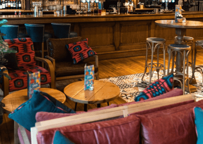 Bespoke restaurant seating in vibrant colours and bold fabrics for an Argentinian-inspired restaurant with a lively atmosphere.