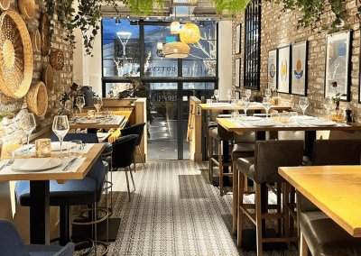 Bespoke bar and restaurant furniture for Botana Jersey, including dining chairs, bar stools and tables, featuring stylish Mediterranean-inspired design.