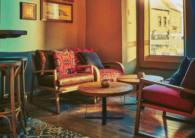 Bespoke restaurant seating in vibrant colours and bold fabrics for an Argentinian-inspired restaurant with a lively atmosphere.