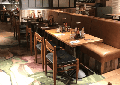 Bespoke furniture and refurbished & reupholstered furniture for an airport restaurant and lounge with a stylish and modern interior.