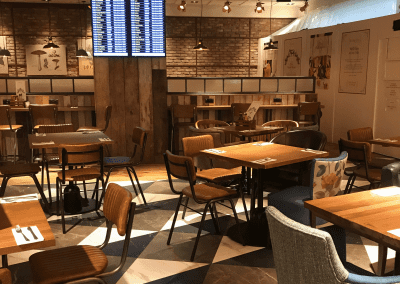 Bespoke furniture and refurbished & reupholstered furniture for an airport restaurant and lounge with a stylish and modern interior.