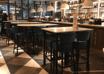 Bespoke furniture and refurbished & reupholstered furniture for an airport restaurant and lounge with a stylish and modern interior.
