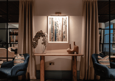 Elegant soft furnishings, featuring bespoke curtains and accent pieces, blending period charm with refined comfort.