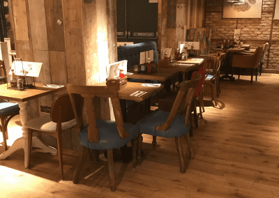 Bespoke furniture and refurbished & reupholstered furniture for an airport restaurant and lounge with a stylish and modern interior.