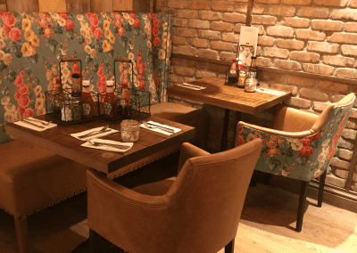 Bespoke furniture and refurbished & reupholstered furniture for an airport restaurant and lounge with a stylish and modern interior.