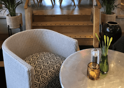 A stylish country pub interior for The Orange Tree Solihull, featuring bespoke dining chairs, tub chairs, and fixed seating made by Jameson Seating.