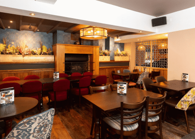 Bespoke pub furniture featuring bold fabrics, vibrant colours, and custom fixed seating by Jameson Seating