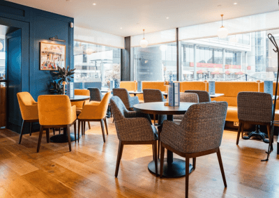 Bespoke café curtains, cushions, and soft furnishings for Côte Brasserie restaurants, combining Parisian charm with durable, stylish design.
