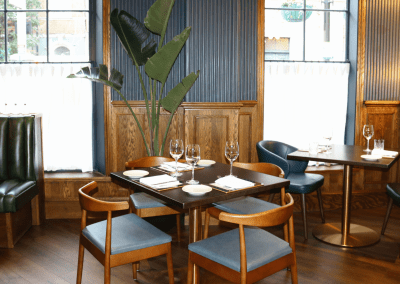 Bespoke eyelet screen curtains for Ganymede Belgravia, creating a stylish and private restaurant space.