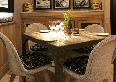A stylish country pub interior for The Orange Tree Solihull, featuring bespoke dining chairs, tub chairs, and fixed seating made by Jameson Seating.