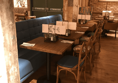 Bespoke furniture and refurbished & reupholstered furniture for an airport restaurant and lounge with a stylish and modern interior.