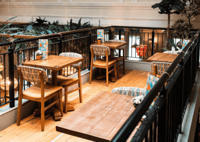 Bespoke restaurant seating in vibrant colours and bold fabrics for Sonrisa Leicester, an Argentinian-inspired restaurant with a lively atmosphere.