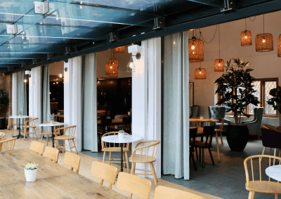 Bespoke curtains and soft furnishings for cafes, in bright and neutral colours to create an inviting and contemporary feel.