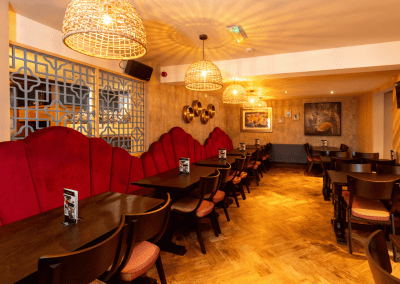 Bespoke pub furniture featuring bold fabrics, vibrant colours, and custom fixed seating by Jameson Seating