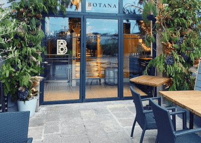 Bespoke bar and restaurant furniture including dining chairs, bar stools and tables, featuring stylish Mediterranean-inspired design.