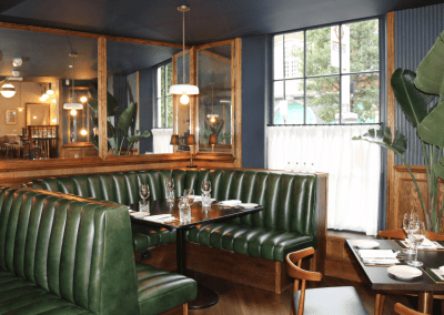 Bespoke eyelet screen curtains for Ganymede Belgravia, creating a stylish and private restaurant space.