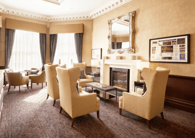 Interior picture of Signature at Hendon Hall care home, featuring calming and comfortable furniture in a range of rooms, to support senior living.