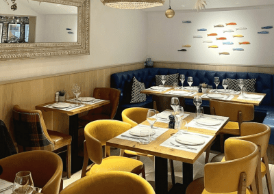 Bespoke bar and restaurant furniture including dining chairs, bar stools and tables, featuring stylish Mediterranean-inspired design.