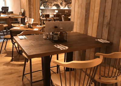 Bespoke furniture and refurbished & reupholstered furniture for The Curator Heathrow, an airport restaurant and lounge with a stylish and modern interior.