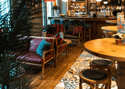 Bespoke restaurant seating in vibrant colours and bold fabrics for an Argentinian-inspired restaurant with a lively atmosphere.