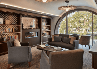 Interior picture of a Signature care home, featuring calming and comfortable furniture in a range of rooms, to support senior living.