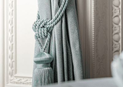 Elegant soft furnishings at Heythrop Park, Oxfordshire, featuring bespoke curtains and accent pieces, blending period charm with refined comfort.