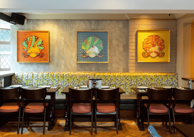 Bespoke pub furniture featuring bold fabrics, vibrant colours, and custom fixed seating by Jameson Seating