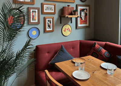 Bespoke restaurant seating in vibrant colours and bold fabrics for an Argentinian-inspired restaurant with a lively atmosphere.