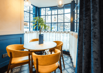 Bespoke café curtains, cushions, and soft furnishings, combining Parisian charm with durable, stylish design.