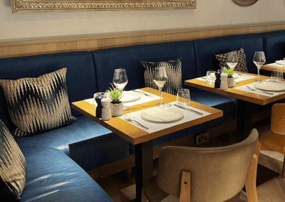 Bespoke bar and restaurant furniture including dining chairs, bar stools and tables, featuring stylish Mediterranean-inspired design.