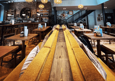 Bespoke restaurant seating in vibrant colours and bold fabrics for an Argentinian-inspired restaurant with a lively atmosphere.