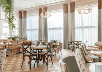 Elegant soft furnishings at Heythrop Park, Oxfordshire, featuring bespoke curtains and accent pieces, blending period charm with refined comfort.