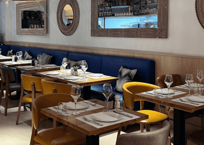 Bespoke bar and restaurant furniture including dining chairs, bar stools and tables, featuring stylish Mediterranean-inspired design.