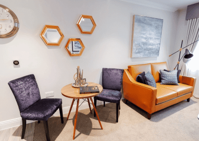 Interior picture of a Signature care home, featuring calming and comfortable furniture in a range of rooms, to support senior living.