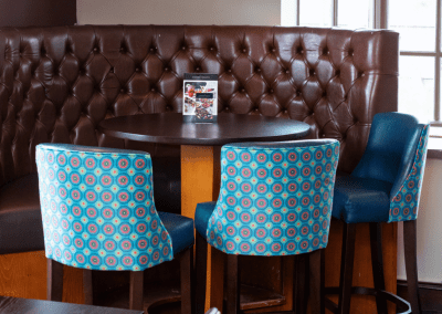 Bespoke pub furniture featuring bold fabrics, vibrant colours, and custom fixed seating by Jameson Seating
