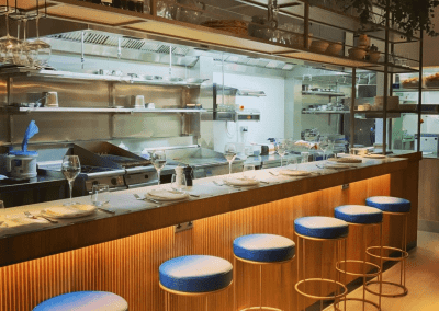 Bespoke bar and restaurant furniture including dining chairs, bar stools and tables, featuring stylish Mediterranean-inspired design.