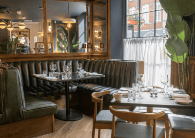 Bespoke eyelet screen curtains for gastropubs, creating a stylish and private restaurant space.